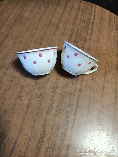 Two hardware cups with red dots.