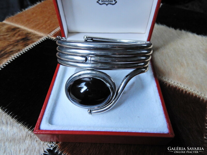 Old, special silver bracelet with a large onyx stone