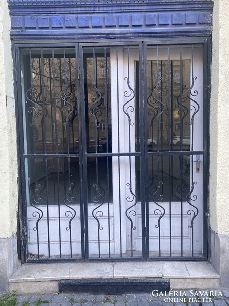 Wrought iron door guard.