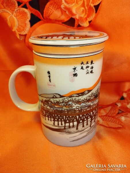 Chinese tea cup with strainer and lid