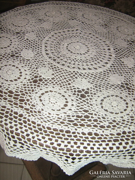 Beautiful white antique hand-crocheted round floral tablecloth