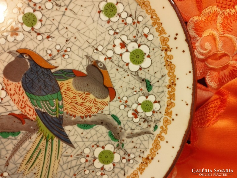 Japanese porcelain plate with birds of paradise