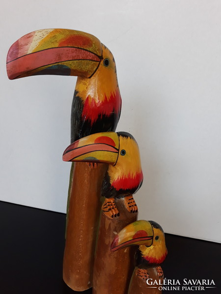 3 Carved and painted wooden toucan statues