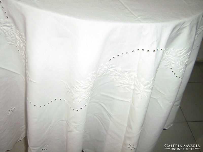 Oval tablecloth embroidered with white on a white background with a beautiful floral pattern from Kalocsa