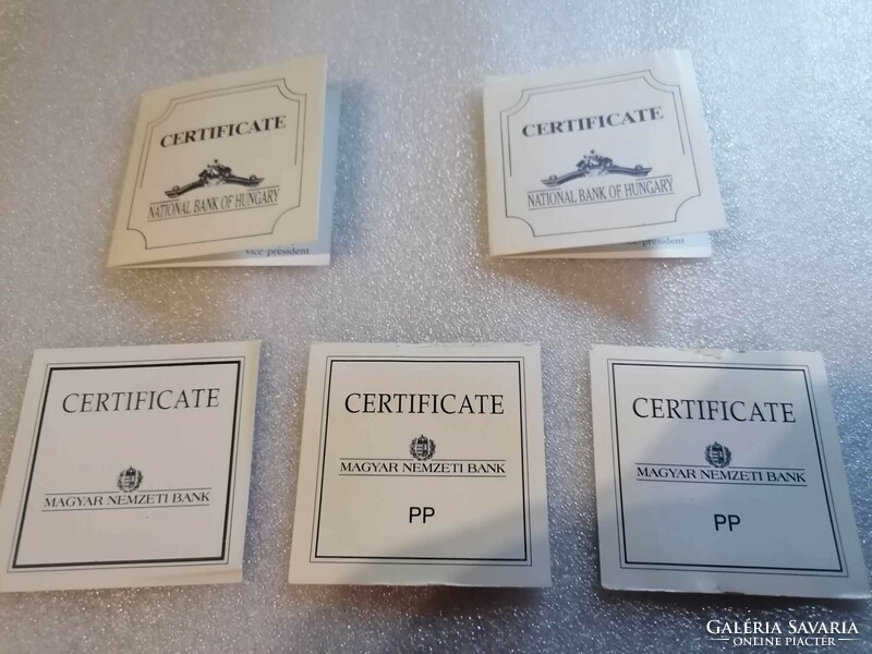 5 different coin certificates
