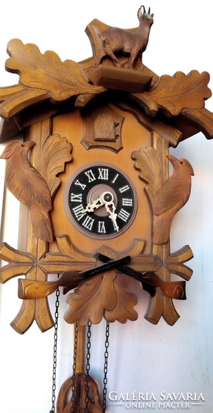 Carved black forest cuckoo clock with chamois
