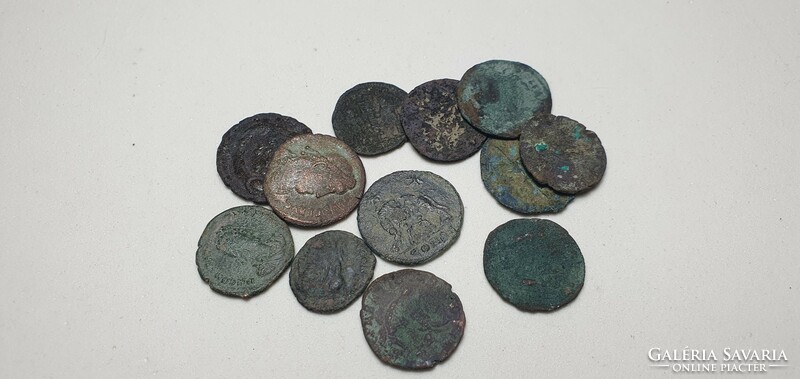 12 antique coins from the era of the Roman Empire.
