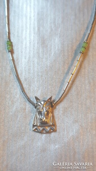 Unique silver chain with horse head motif.