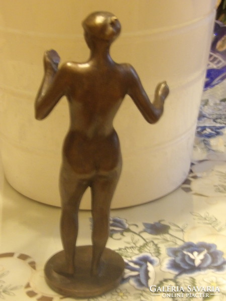 Jánosí Blaskó: a bronze statue of a woman looking at herself in a mirror