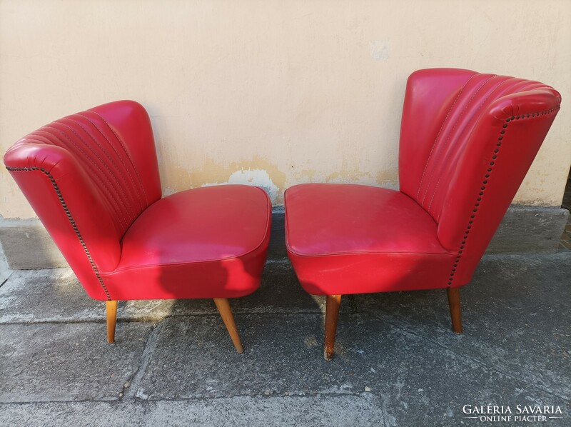 Iconic retro sky armchairs 1 each, covered with fire red leather, on stiletto legs