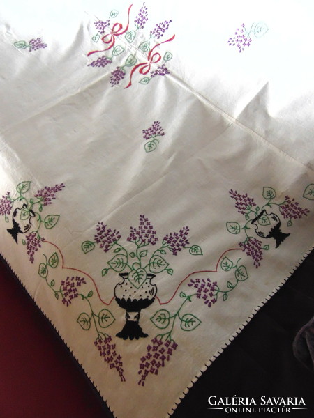 Antique embroidered linen tablecloth with lilac flowers