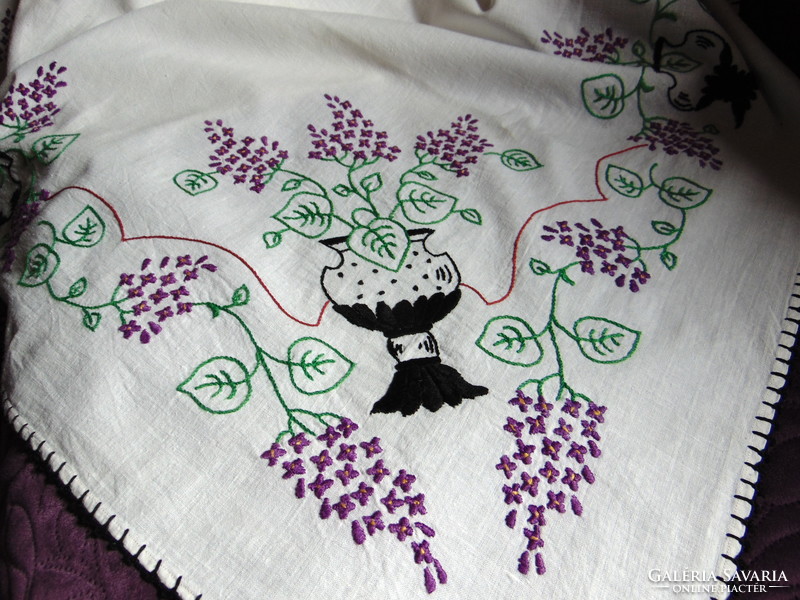 Antique embroidered linen tablecloth with lilac flowers