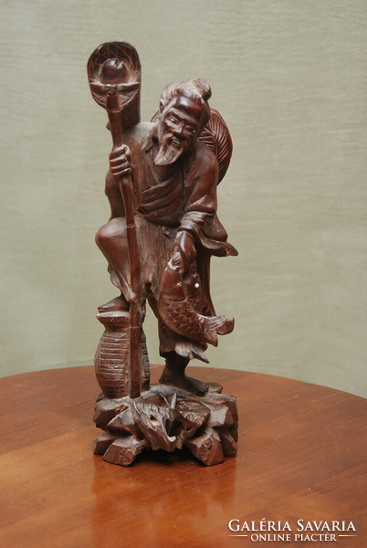 Far Eastern fisherman exotic wooden sculpture
