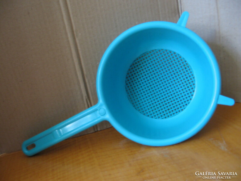 Pasta strainer with a blue plastic handle