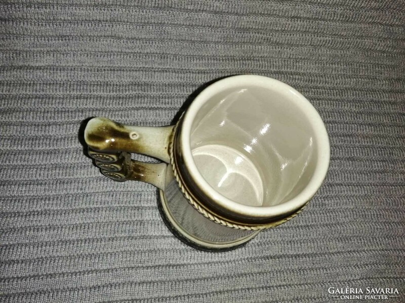 German ceramic beer mug with image of a man smoking a pipe, plisting 1983 (a12)