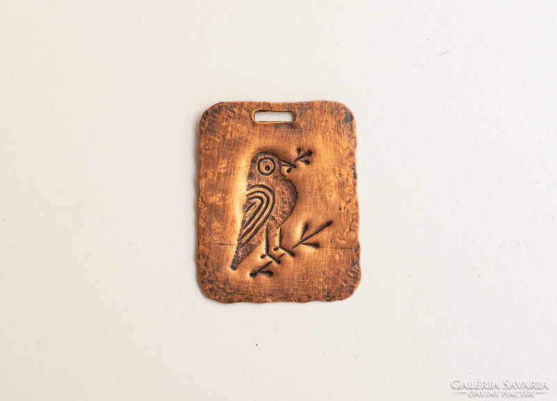 Retro metal pendant with a bird - embossed copper sheet craftsman jewelry