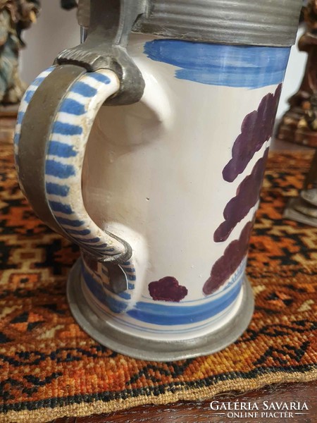 18th century German faience jug. With the inscription 1773-As and signature at the bottom. 25cm high.