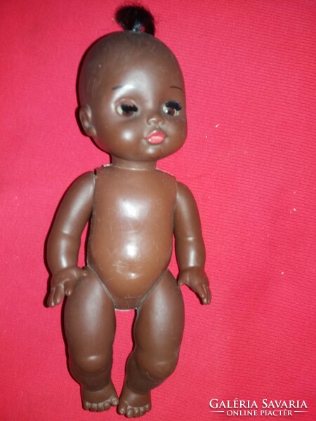 Antique nutmeg numbered black plastic toy doll 26 cm in nice condition according to the pictures