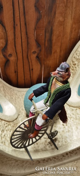 Fox fantasy figure sitting on a velocipede - decor 30 cm