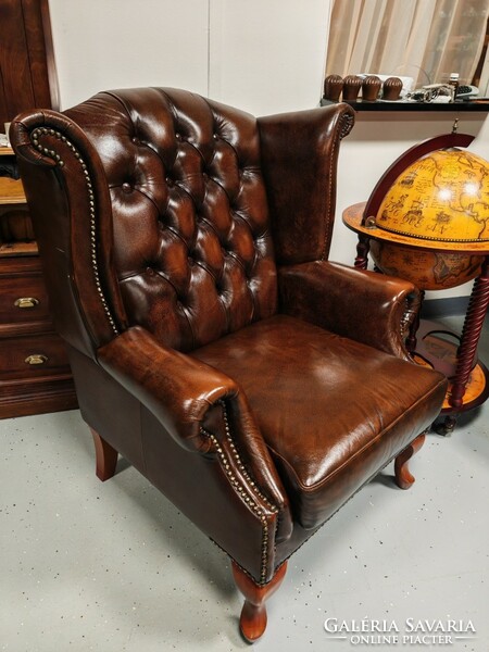 A pair of original English Chesterfield wingback armchairs, in beautiful, patina condition