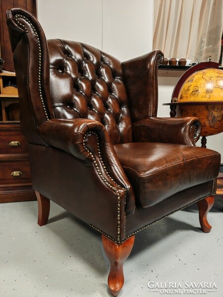 A pair of original English Chesterfield wingback armchairs, in beautiful, patina condition