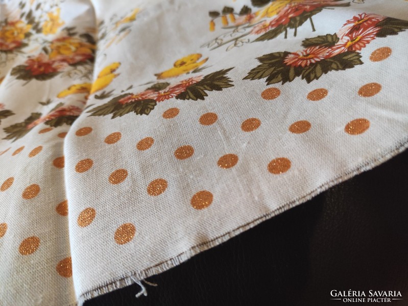 A huge, strong linen tablecloth waiting to be sewn, a do-it-yourself, shiny, polka dot, cheerful spring atmosphere