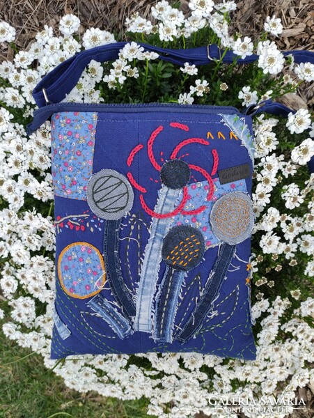 Bag decorated with hand stitching