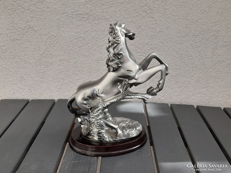 Equestrian statue on a ceramic plinth