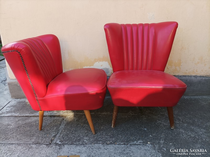 Iconic retro sky armchairs 1 each, covered with fire red leather, on stiletto legs