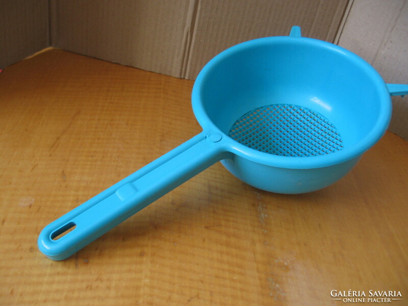Pasta strainer with a blue plastic handle