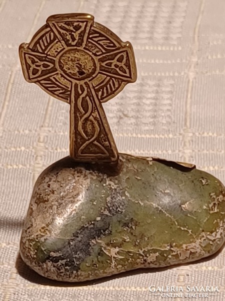 Brass Celtic cross on marble