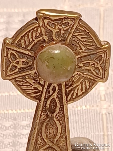Brass Celtic cross on marble