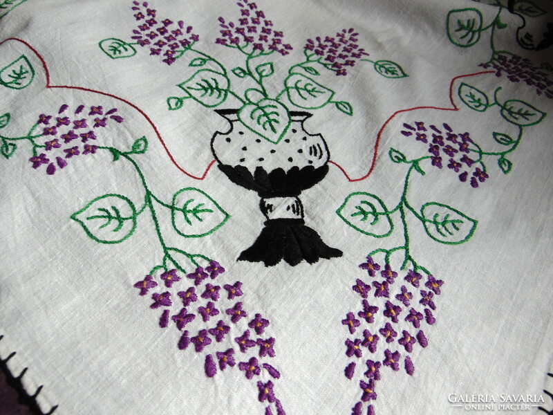 Antique embroidered linen tablecloth with lilac flowers