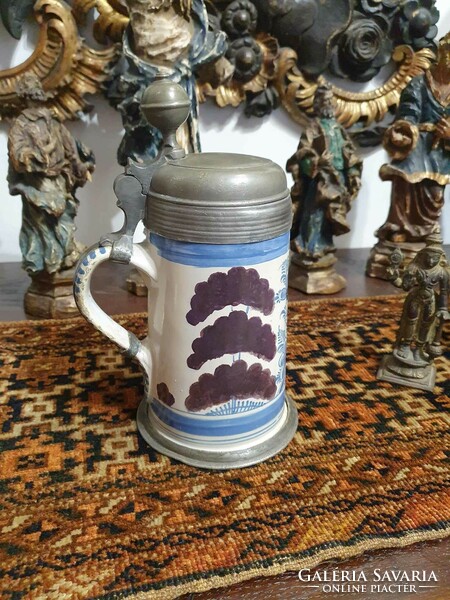 18th century German faience jug. With the inscription 1773-As and signature at the bottom. 25cm high.