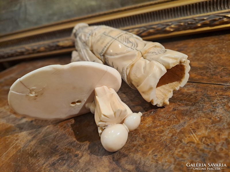 Original Japanese carved bone okimono sage holding Buddha