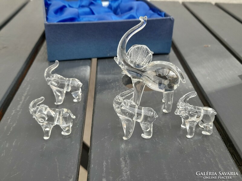 A fairy-tale family of elephants made of detailed glass