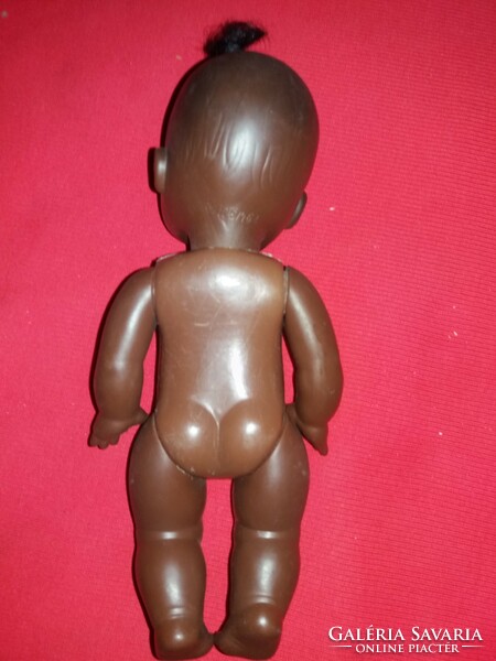Antique nutmeg numbered black plastic toy doll 26 cm in nice condition according to the pictures
