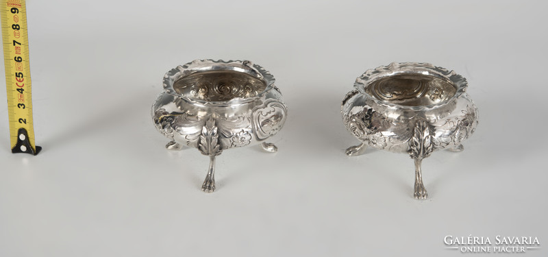 Pair of silver spice racks with stylized lion legs