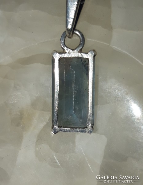 Old silver pendant with topaz stones
