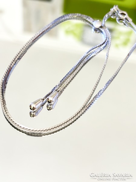 Fabulous silver necklace-necklace, embellished with pendants.