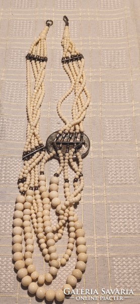 Bone necklace with elephant logo
