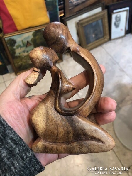 A loving couple sculpture made of wood, 14 cm in size.