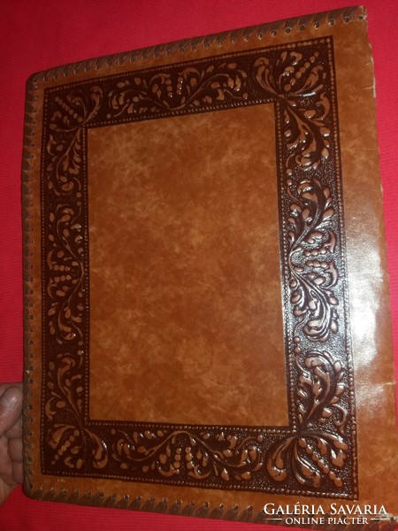 A leather folder laced along the relief side of an antique ship for 3 documents as shown in the pictures