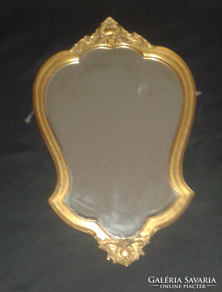 Baroque mirror with antique wooden frame, the frame has antique gilding