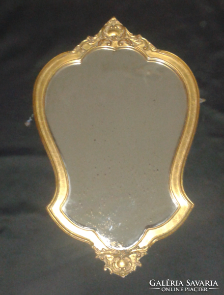 Baroque mirror with antique wooden frame, the frame has antique gilding