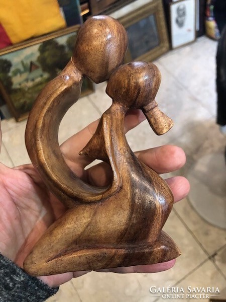 A loving couple sculpture made of wood, 14 cm in size.
