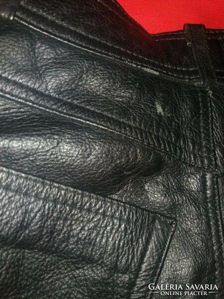 Quality black original thick leather motorcycle pants with laces on the side, in good condition as shown in the pictures