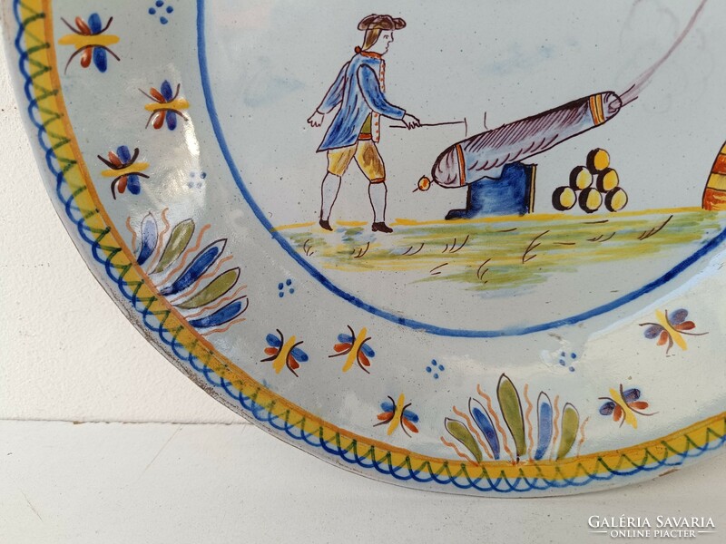 Antique Delft porcelain plate with painted cannon military cardboard motif hairline crack 19th century 8643