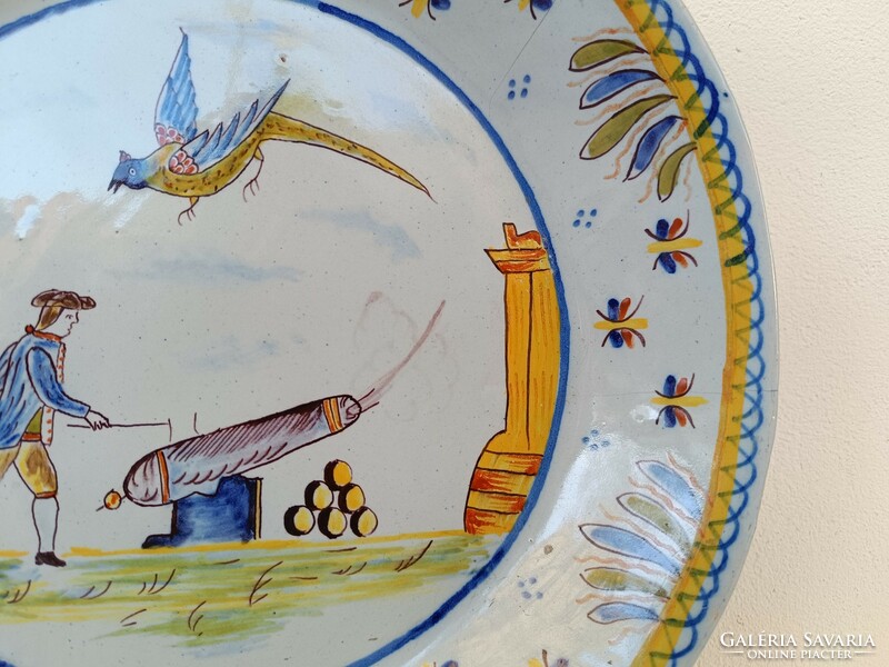 Antique Delft porcelain plate with painted cannon military cardboard motif hairline crack 19th century 8643