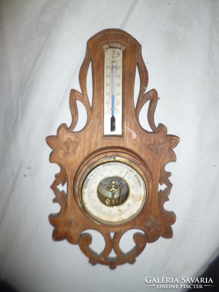 Antique 100-year-old art nouveau barometer in a carved case